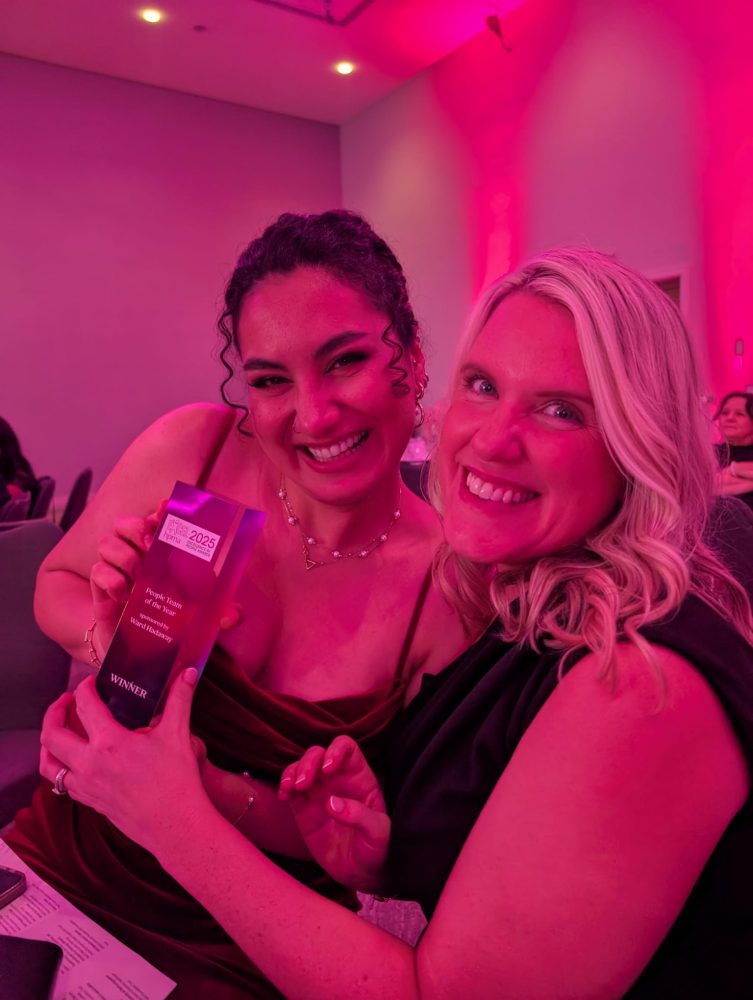Two women with a trophy